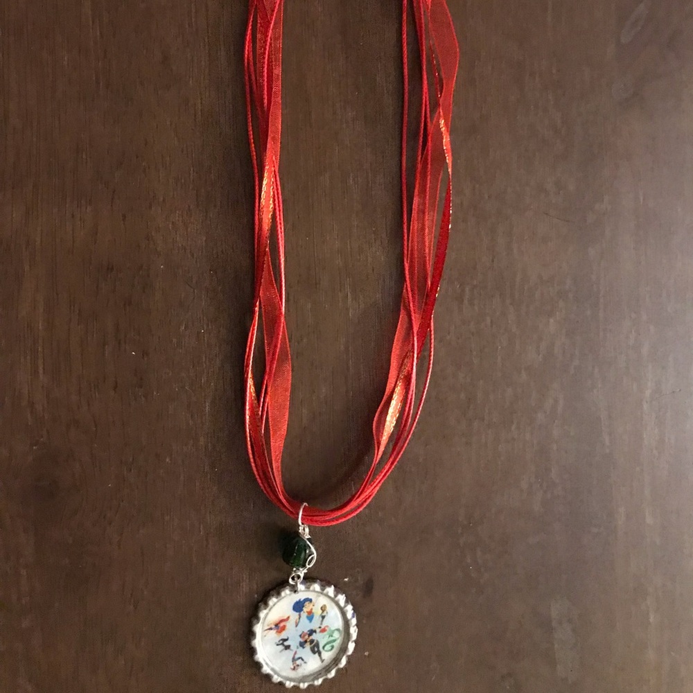 Awesome superhero girl bottlecap necklace.